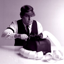 Accountant using old time adding machine